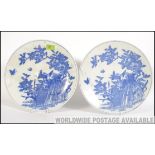 A pair of Chinese blue and white wall chargers dating from the believed late 19th century in the