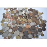 A collection of coins from all around the world some dating to the late 18th century to include