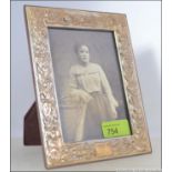 A rococo silver 925 photograph frame having easel back,