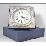 A silver hallmarked Adams revival easel backed mantel clock, hallmarked for Douglas Pell Silverware,