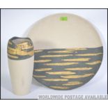 A large 20th century Italian made studio pottery wall charger along with a matching studio pottery