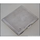 A silver hallmarked cigarette case bearing marks for Birmingham 1917 by Dudley Russell Howitt