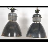 A pair of mid century - 1960's industrial factory pendant lights.