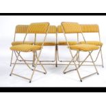 A set of retro 1970's 20th century folding conference / hall chairs by Lafuma with gilt tubular