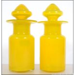 A fabulous pair of Uranium lidded bon bon jars. Of cylindrical form with large stoppers.