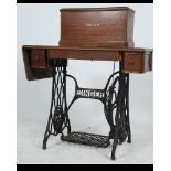 A Singer sewing machine circa 1900, with iron A Singer sewing machine circa 1900,