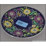 An early 20th century enamel dish with silver rim designed with flower and forget-me-nots.