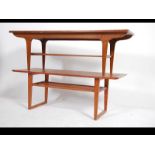 A retro 1970's teak coffee table of rectangular form together with another similar but of angular