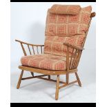 A contemporary Ercol 741 pattern Windsor armchair with good contemporary cushions to the beech and