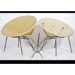 A set of 2x retro interior vinyl wicker and metal based chairs along with a magazine rack and coat