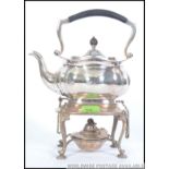A silver plated early 20th century spirit kettle on stand, in the Dresser style, on pad foot,