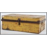 A vintage early to mid 20th century painted tin steamer / travel trunk of rectangular form with