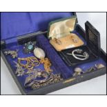 A small collection of costume and silver jewellery to include brooches, bracelets,