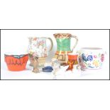 A collection of ceramics to include Poole Pottery, Decora pottery art deco jug,