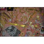An extensive collection of costume jewellery to include brooches, bracelets, bangles etc.