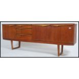 A 1970's Danish influence sideboard raised on angled legs with returns.