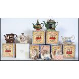 A collection of eight boxed collectors novelty teapots by Paul Cardew.