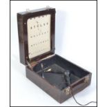 A vintage early to mid 20th century oak cased Optometrists mobile eye test kit.