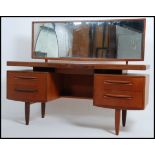 A 1970's G-Plan teak wood dressing table in the manner of Mogens Kolo.