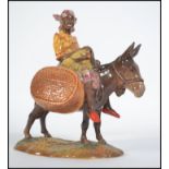 A vintage 20th century Beswick pottery " Susie Jamaica " figurine depicting a girl riding a donkey,