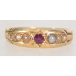 An 18ct gold, ruby and pearl ladies gypsy ring.