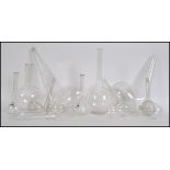 A collection of vintage / retro Chemists / Apocathery large and small distillation retorts,