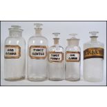 A collection of five vintage late 19th century W N Chemist Apothecary bottles .