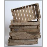 A set of 8 vintage industrial mid century apple crates - stacking. Wooden slatted construction.