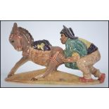 A Beswick figure of a Spaniard pushing a donkey, model 1224,