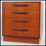 A 1970's G-Plan teak wood Kelso Pattern chest of drawers being raised on an inset plinth with