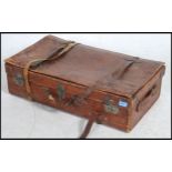 A good quality vintage tan leather suitcase retaining all the original leather straps.