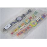 A collection of 3 vintage Swatch watches, all in original packaging.