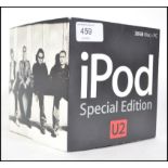 An Original first Generation Apple U2 Ipod which Includes packaging and poster etc