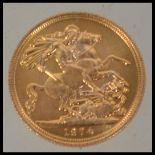 Coins. An Elizabeth II gold Sovereign, 1974, St George and the Dragon to verso. Total weight 8.