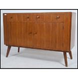 A mid 20th century retro teak sideboard in the manner of Vanson.