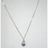 A 9ct white gold diamond and amethyst necklace and pendant. Total weight 3.