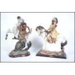 A pair of large ceramic Native American Indian figures on horse back.