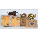 A collection of three boxed large limited edition collectors novelty teapots by Paul Cardew to