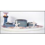 A stunning 20th century Art Deco hand painted Bristol Poutney dressing table set.