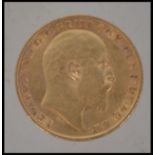 Coins. An Edward VII gold half Sovereign, 1910, St George and the Dragon to verso.