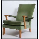 A 20th century vintage Parker Knoll open framed armchair having a spring base with original fabric