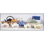 A collection of various China and ceramic teapots from various makers to include Arthur Wood etc.