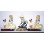 A group of three Royal Doulton Bone China figures to include a pair of ' Golden Days ' HN2274