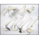 A group of three 20th century vintage / retro 1970's Herbert Terry Anglepoise lamps with a white