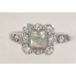 An Art Deco 9ct gold and silver ring with paste stones. Marked 9ct and Sil. Tests 9ct and silver.