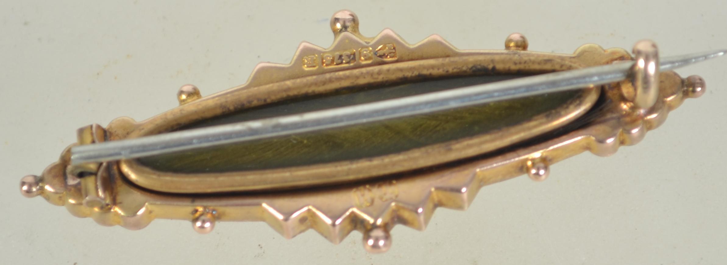 A hallmarked Victorian 9ct gold / 375 Chester hallmarked bar and filigree brooch with inset central - Image 2 of 2