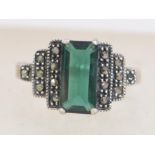 A silver 925 Art Deco style ladies dress ring with central baguette green stone with marcasite step