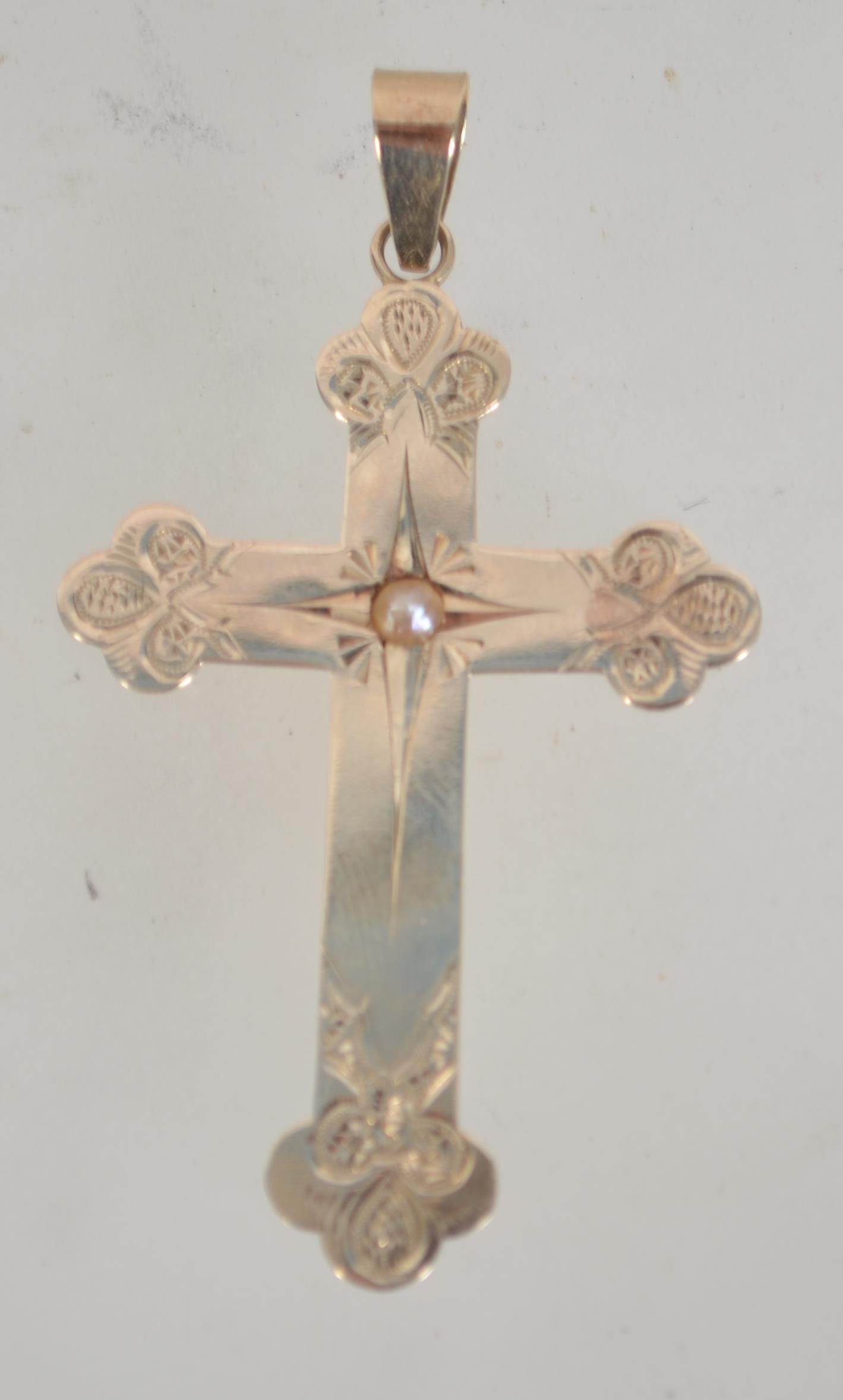 A Victorian 14ct gold crucifix with engraved decoration and central mounted pearl.