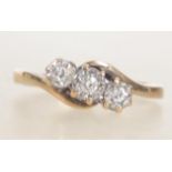 A hallmarked 9ct gold and diamond ladies 3 stone crossover ring . Hallmarked for Sheffield.