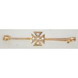 A early 20th century 9ct gold and seed pearl bar brooch pin with Maltese cross emblem set with seed